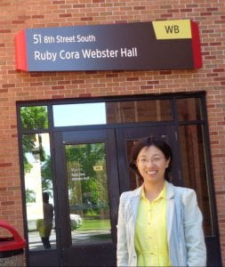 Dr. Chen in front of Ruby Cora Webster Hall