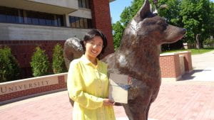 Dr. Chen in front of SCSU husky