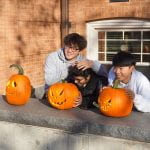 Students by their pumpkins