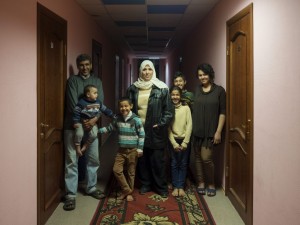 A family of Syrian refugees at the Polar Light Hotel in Nikel, Russia. October 2015. (Alessandro Iovino)