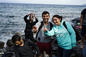 Mahmud, 28 and his bride Firal, 25, from the Syrian city of Kobane show their rings, as they arrive with other refugees and migrants on the Greek island of Lesbos, after crossing the Aegean sea from Turkey on October 8, 2015. Europe is grappling with its biggest migration challenge since World War II, with the main surge coming from civil war-torn Syria. Greek premier Alexis Tsipras said on October 6, 2015 that Athens would upgrade its refugee facilities by November to tackle the growing influx from Syria as the EU pledged 600 extra staff to help. AFP PHOTO / DIMITAR DILKOFF        (Photo credit should read DIMITAR DILKOFF/AFP/Getty Images)
